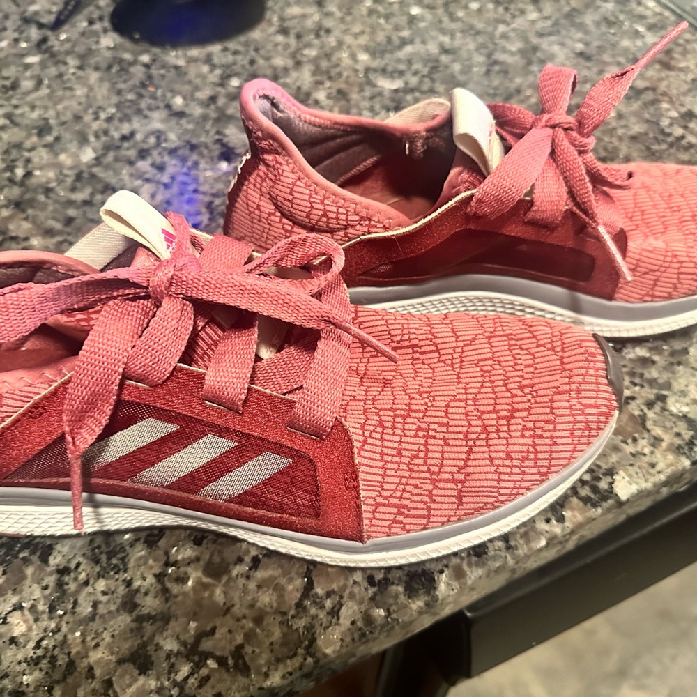 Woman’s 9.5 Adidas Edge Lux red lightly used tennies.
